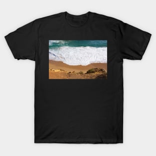 White water rolls in over orange sand at Port Campbell, Australia. T-Shirt